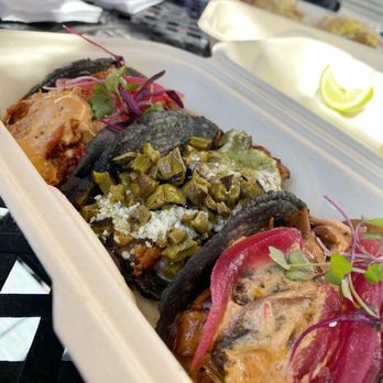 Macheen - Taco selection...sadly I couldn't eat more than three.  Husband working on a burrito in the rear. - Pop-Up Restaurants Near Me - Los Angeles, California