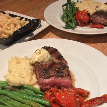 Seasons 52 - Wood-Grilled Kona-Crusted Lamb Loin, green beans, yukon mash, Roasted Tomato, Mac 'N' Cheese - Seafood Near Me - Birmingham, Alabama Seasons 52 - Wood-Grilled Kona-Crusted Lamb Loin, green beans, yukon mash, Roasted Tomato, Mac 'N' Cheese - Seafood Near Me - Birmingham, Alabama