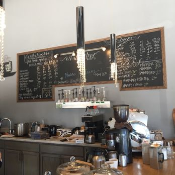 Lola's Cafe - a woman standing in front of the counter - Coffee & Tea Near Me - Brighton, Ontario