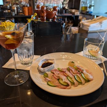 Hugo's Seafood Bar - Cynarly (left), hamachi crudo (a MUST order), and Blame it on the Juice - Seafood Near Me - Dallas, Texas Hugo's Seafood Bar - Cynarly (left), hamachi crudo (a MUST order), and Blame it on the Juice - Seafood Near Me - Dallas, Texas