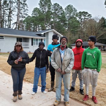 Landscape 4 Life - a group of people standing in front of a house - Lawn Services Near Me Landscape 4 Life - a group of people standing in front of a house - Lawn Services Near Me