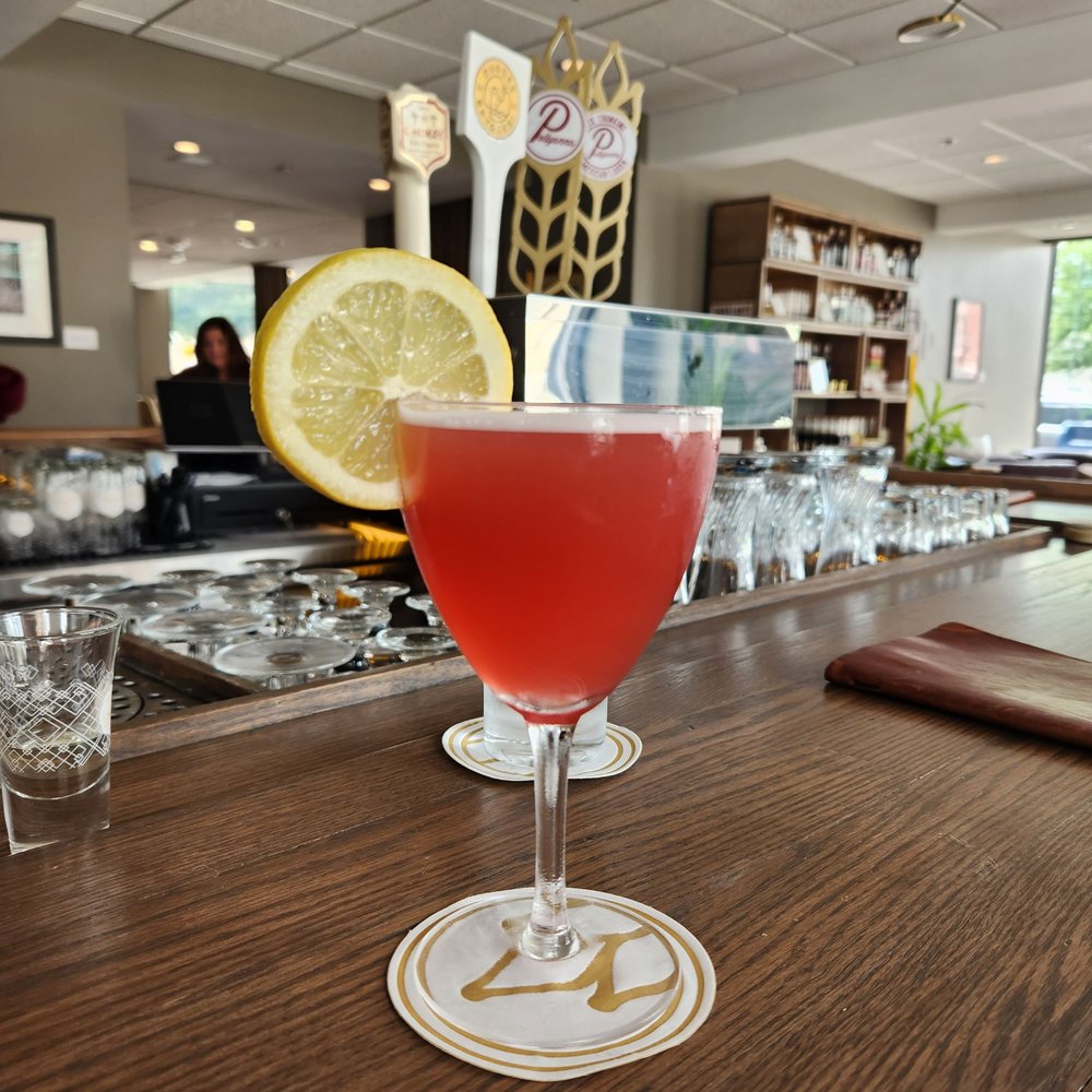 a drink in a glass on a bar a drink in a glass on a bar