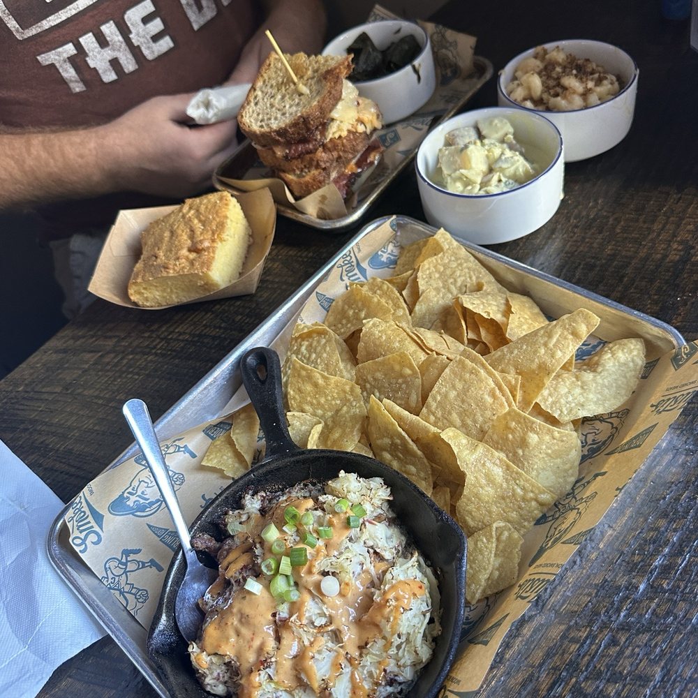 Smoke Justis - Reuben sandwich w/ greens, macaroni N' cheese, potato salad, cornbread Pastrami dip w/ chips - Bars Near Me - Covington, Kentucky Smoke Justis - Reuben sandwich w/ greens, macaroni N' cheese, potato salad, cornbread Pastrami dip w/ chips - Bars Near Me - Covington, Kentucky