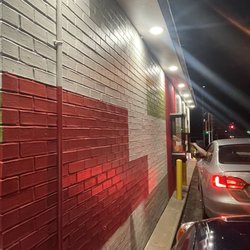 Taco John's - Thought the light and building paint were cool. Dude in front paid it forward. Happy Friday!