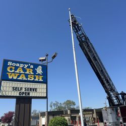 Soapy's Car Wash - Thanks to TRFD for assisting in threading the new flag rope!