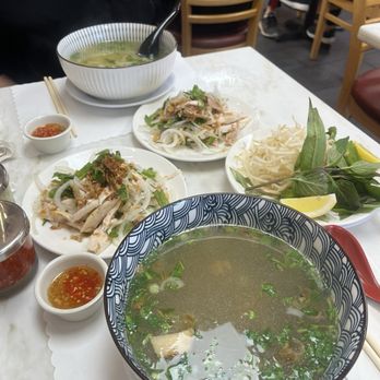 Ghien Mien Ga - Mien ga (front) and pho ga (back) both with goi ga/chicken salad - Noodles Near Me - Westminster, California Ghien Mien Ga - Mien ga (front) and pho ga (back) both with goi ga/chicken salad - Noodles Near Me - Westminster, California