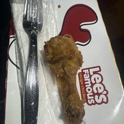 Lee's Famous Recipe Chicken - This is what a leg looks like at Lee's.  It is being compared to the plastic fork that comes with the napkin.