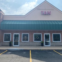 GLO Beauty & Tan - Front Entrance Parking lot view