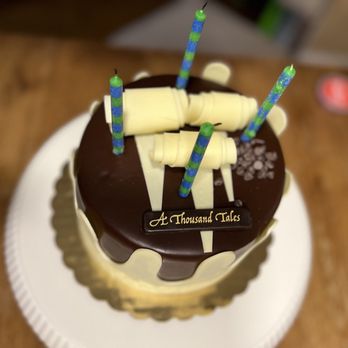 A Thousand Tales - a chocolate cake with candles on top - Turkish Near Me - Mount Prospect, Illinois