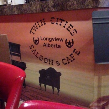 TWIN CITIES HOTEL - a cow in a restaurant - Bars Near Me - Longview, Alberta