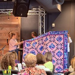 Trinity Church - Gwen receiving a quilt from our sewing ministry helping hands.