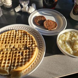 Pecan waffle, sausage patties and grits