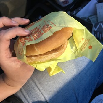 McDonald's - a person holding a sandwich in their lap - Burgers Near Me - Monticello, Kentucky McDonald's - a person holding a sandwich in their lap - Burgers Near Me - Monticello, Kentucky