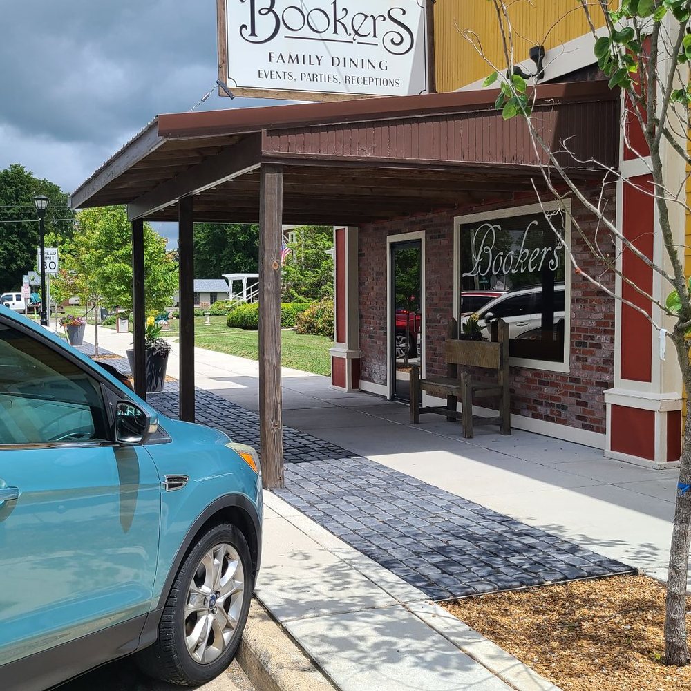 Exterior view of restaurant with street parking. Exterior view of restaurant with street parking.