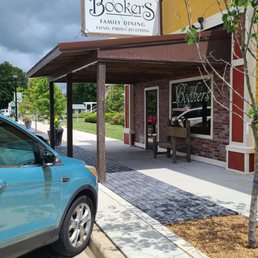 Exterior view of restaurant with street parking. Exterior view of restaurant with street parking.