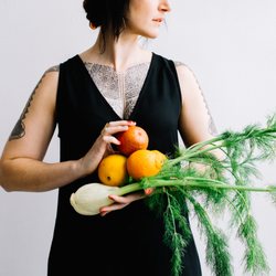 Body Mind Belly - ID: Woman holding fruits and vegetables. Photo by Brit Alamillo.