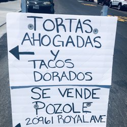 Signage in front of driveway.
