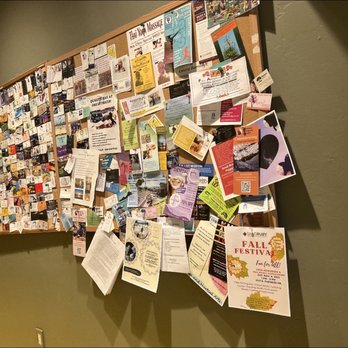 Le Buzz Caffe - The board by the bathroom with local businesses on it - Coffee & Tea Near Me - Tucson, Arizona