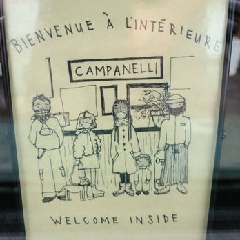 Campanelli - a group of people standing in front of a sign - Cafes Near Me - Montreal, Quebec