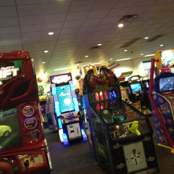 Chuck E. Cheese - a row of arcade machines - Pizza Near Me - Denton, Texas