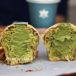 Halekulani Bakery - Inside of Matcha Cream Pan ($6.50) - the bread has a bit of red bean. The matcha cream is smooth and has a noticeable matcha flavor.