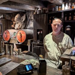 Hogsmeade - Inside Hog's Head at Hogsmeade at Universal's Islands of Adventure. Checking out with the bartender.
