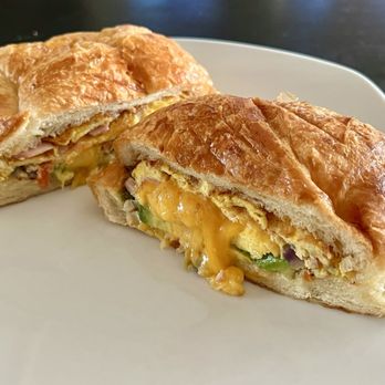 Scotts Donuts & Cafe - Croissant Sandwich. So much going for this. Avocado. Tomatoes. Cheese. Ham. Scrambled eggs. Onions. - Bakeries Near Me - Mission Viejo, California Scotts Donuts & Cafe - Croissant Sandwich. So much going for this. Avocado. Tomatoes. Cheese. Ham. Scrambled eggs. Onions. - Bakeries Near Me - Mission Viejo, California