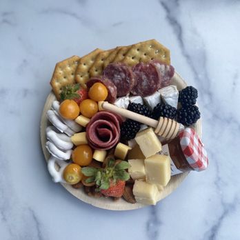 Gouda Thymes Boards - a plate of cheese, crackers, and fruit - Food Delivery Services Near Me