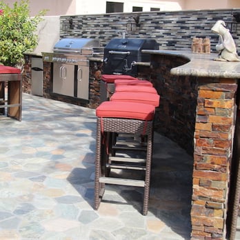Top Project - an outdoor kitchen with bar stools - General Contractors Near Me - Cathedral City, California Top Project - an outdoor kitchen with bar stools - General Contractors Near Me - Cathedral City, California