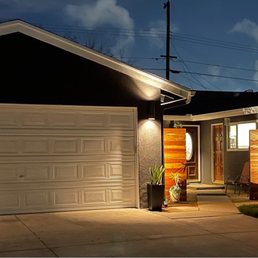 AMR installed the lights fixtures on either side of the garage and installed receptacles on either side of the walkway.