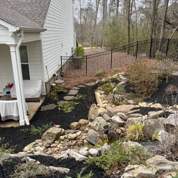 Gossett's Lawn Care - a garden with rocks and plants - Lawn Services Near Me Gossett's Lawn Care - a garden with rocks and plants - Lawn Services Near Me