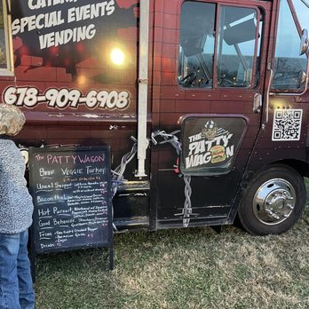 The Patty Wagon - a woman standing next to a food truck - Chicken Wings Near Me - Marietta, Georgia The Patty Wagon - a woman standing next to a food truck - Chicken Wings Near Me - Marietta, Georgia