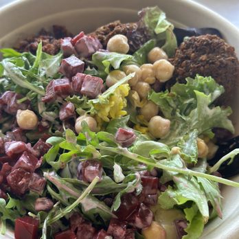 SAJJ Mediterranean - Falafel Rice Bowl with hummus spread, sumac cauliflower, garbanzo beans, mixed greens and arugula, beets, and tahini sauce. - Mediterranean Near Me - San Bruno, California SAJJ Mediterranean - Falafel Rice Bowl with hummus spread, sumac cauliflower, garbanzo beans, mixed greens and arugula, beets, and tahini sauce. - Mediterranean Near Me - San Bruno, California