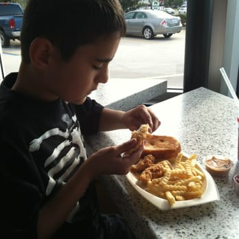 Raising Cane's Chicken Fingers - John's very serious about his chicken - Chicken Wings Near Me - Thibodaux, Louisiana Raising Cane's Chicken Fingers - John's very serious about his chicken - Chicken Wings Near Me - Thibodaux, Louisiana