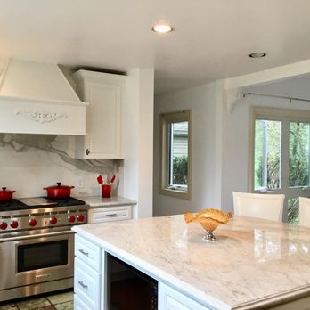Kitchen Cornerstones - a white kitchen with marble countertops - General Contractors Near Me - Newton, Massachusetts