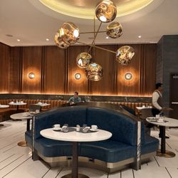 Delta One Lounge - One area of seating accommodates larger groups.