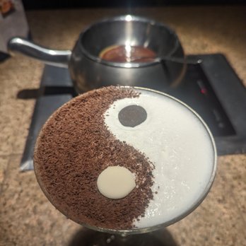 The Melting Pot - Yin & Yang Martini - Godiva White Chocolate Liqueur, Vanilla Vodka, Ice Cream, Chocolate Fondue Shavings - Fondue Near Me - Wilmington, Delaware The Melting Pot - Yin & Yang Martini - Godiva White Chocolate Liqueur, Vanilla Vodka, Ice Cream, Chocolate Fondue Shavings - Fondue Near Me - Wilmington, Delaware