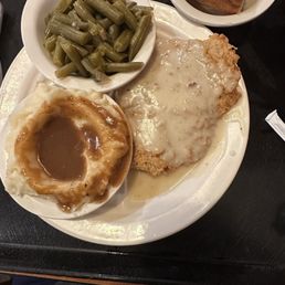 Luann with chicken fried steak. Mashed potatoes, green beans and a dinner roll