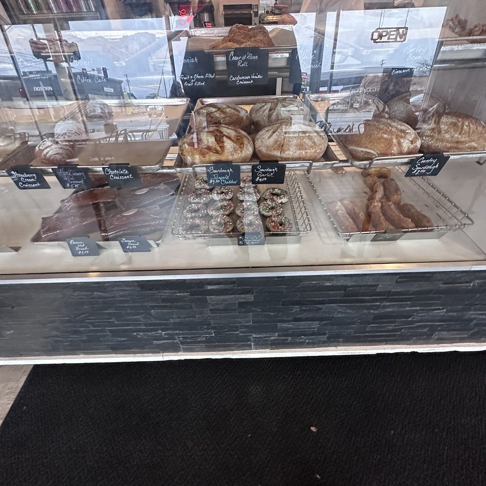 Breaking Bread Artisan Bistro - a person standing in front of a bakery - Breakfast & Brunch Near Me - Coeur d'Alene, Idaho Breaking Bread Artisan Bistro - a person standing in front of a bakery - Breakfast & Brunch Near Me - Coeur d'Alene, Idaho