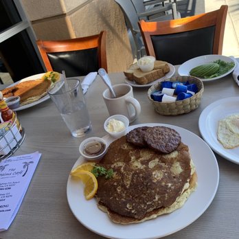 The Palms Cafe - Banana Walnut Pancakes, 2 Sausage Patties, a side of Over Easy Eggs. Short Stack w/Sausage Patties. Toast with 1/2 Avocado. - Cafes Near Me - La Quinta, California The Palms Cafe - Banana Walnut Pancakes, 2 Sausage Patties, a side of Over Easy Eggs. Short Stack w/Sausage Patties. Toast with 1/2 Avocado. - Cafes Near Me - La Quinta, California