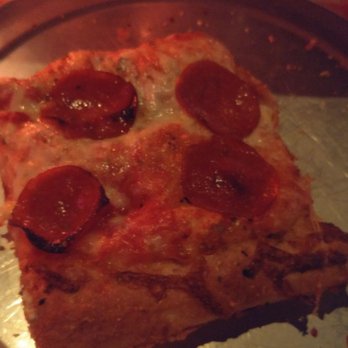 Home Slice Pizza - One of nine slices from a Sicilian pizza - Pizza Near Me - Austin, Texas
