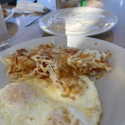 AM Cafe - Half order biscuits & gravy, with added eggs and hashbrowns.