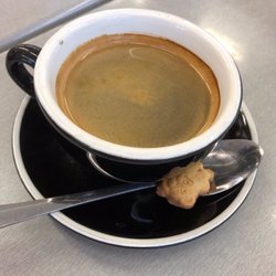 Obsess Cafe - Coffee ... served with chocolate Teddy Bear biscuit. Nice touch.