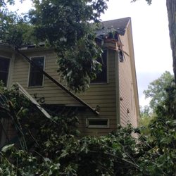 Acorn Tree Care - The is the back of my home after several nights of storms. At least 5 very large trees came down and did a number on my house