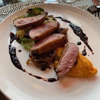 Stage Restaurant - Tender and juicy duck filets served with creamy butternut sqush - New American Near Me - Honolulu, Hawaii