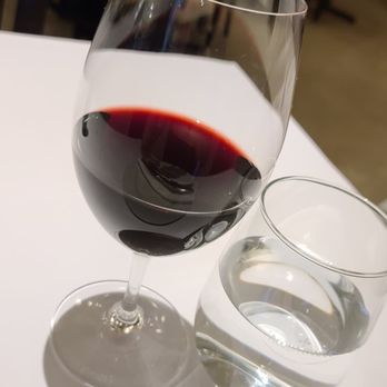 Bottega - a glass of red wine and a glass of water - Pizza Near Me - Montreal, Quebec