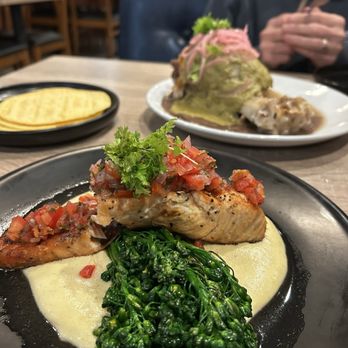 Toast & Tonique - Grilled Salmon in front, Confit Pork Shank in back - Breakfast & Brunch Near Me - Newark, California Toast & Tonique - Grilled Salmon in front, Confit Pork Shank in back - Breakfast & Brunch Near Me - Newark, California