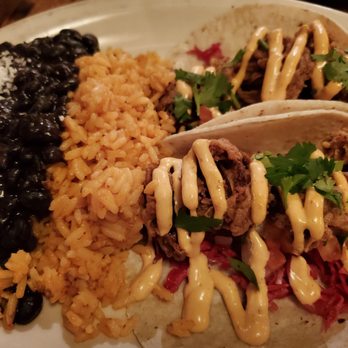 Jose and Sons - Fried oyster tacos. Great spicy sauce on these. Rice and beans were super tasty. - New American Near Me - Raleigh, North Carolina