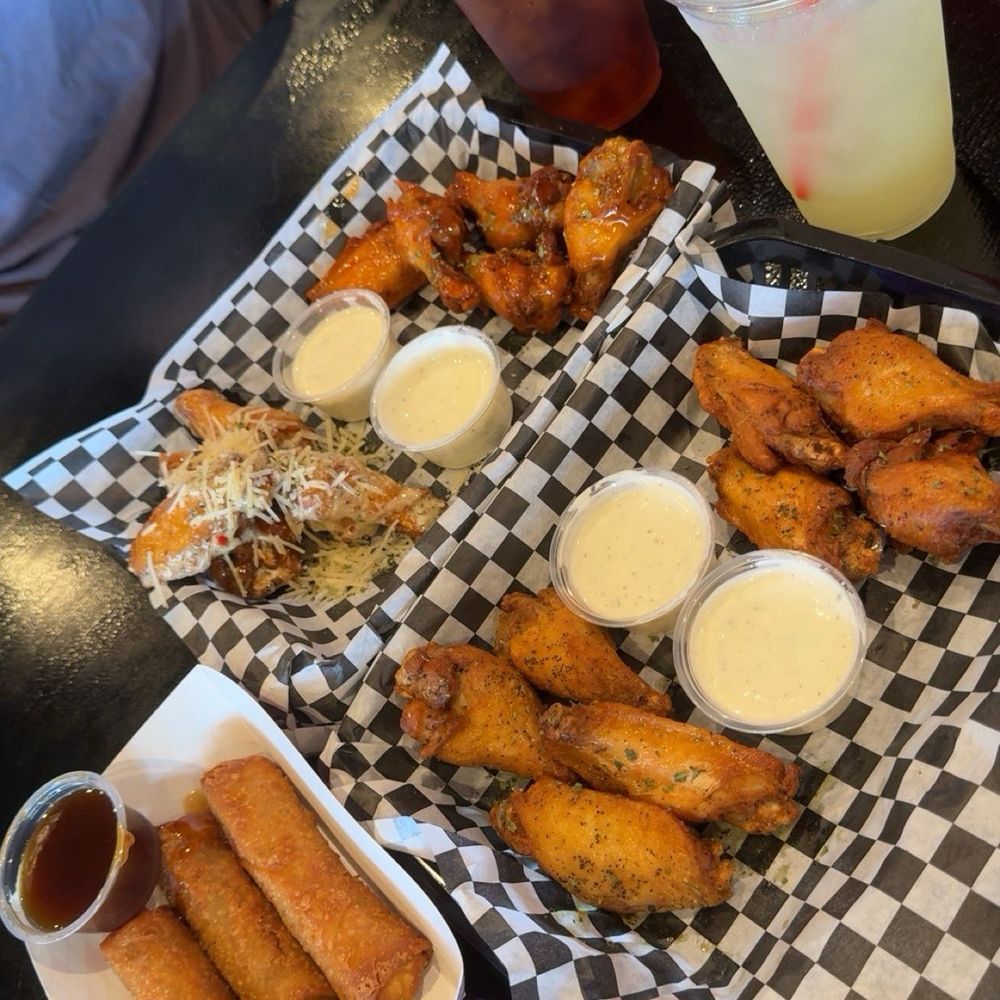 Bone in, non breaded wings with boudin egg rolls Bone in, non breaded wings with boudin egg rolls