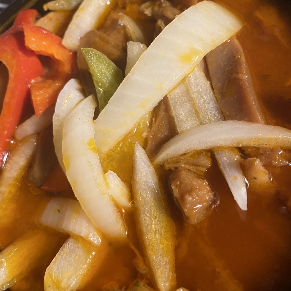 L'Antillaise Caterers and Restaurant - Lambi (conch) with onions peppers in sauce - Haitian Near Me - Franklin Square, New York L'Antillaise Caterers and Restaurant - Lambi (conch) with onions peppers in sauce - Haitian Near Me - Franklin Square, New York